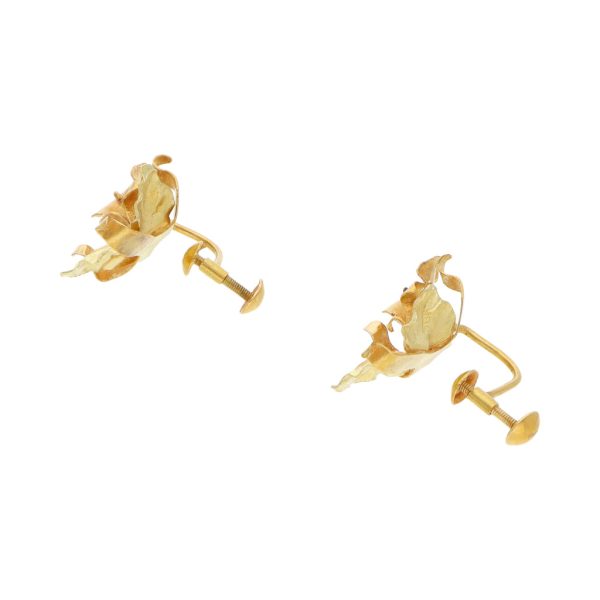 Aretes laminados motivo floral en oro dos tonos 18 kilates. Hot on Sale