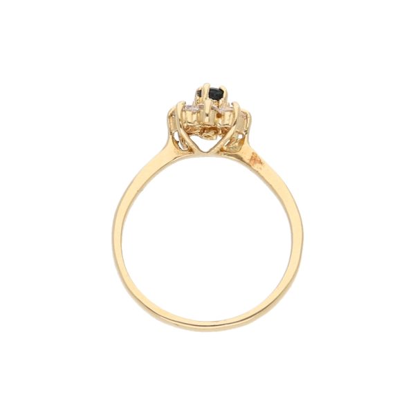 Anillo estilizado motivo floral con circonias y zafiro en oro amarillo 14 kilates. For Sale