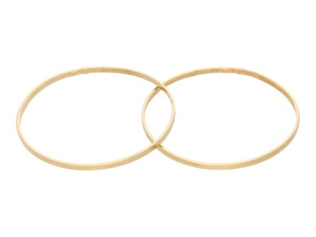 Dos pulseras de arillo huecas en oro amarillo 14 kilates. For Discount