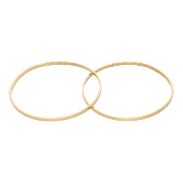 Dos pulseras de arillo huecas en oro amarillo 14 kilates. For Discount