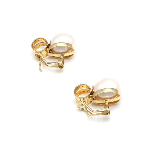 Aretes estilizados con perlas calabazo y diamantes en oro amarillo 14 kilates. on Sale