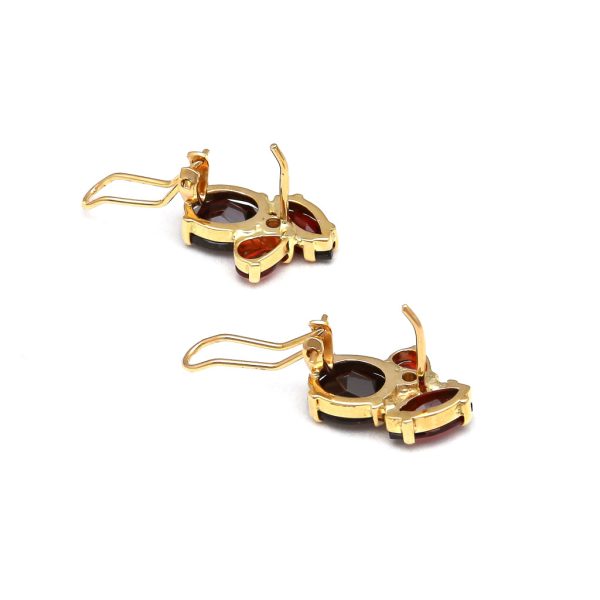 Aretes estilizados con diamantes y granates en oro amarillo 14 kilates. Discount