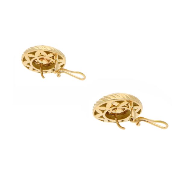 Aretes estilizados con perlas en oro amarillo 18 kilates. Online now