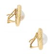 Aretes estilizados con perlas en oro amarillo 18 kilates. Online now