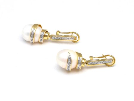 Aretes estilizados con colgantes, diamantes y perlas calabazo en oro amarillo 14 kilates. Discount