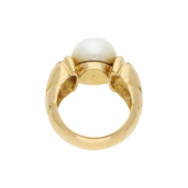 Anillo estilizado con perla en oro amarillo 18 kilates. Online Sale