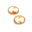 Aretes estilizados con corniolas motivo dama en oro amarillo 14 kilates. Sale