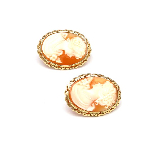 Aretes estilizados con corniolas motivo dama en oro amarillo 14 kilates. Sale