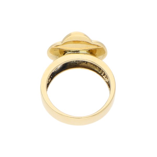 Anillo estilizado motivo floral y corazón con sintético en oro amarillo 18 kilates. For Discount