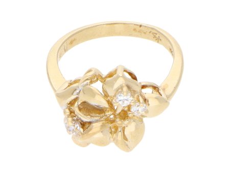 Anillo estilizado motivo floral con circonias en oro amarillo 14 kilates. Discount