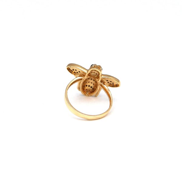 Anillo estilizado motivo abeja con sintéticos en oro amarillo 14 kilates. Supply