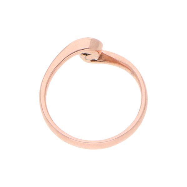 Anillo ondulado con diamante en oro rosa 14 kilates. Online now