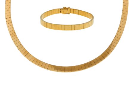 Juego de gargantilla y pulsera eslabón articulado en oro amarillo 18 kilates. Online