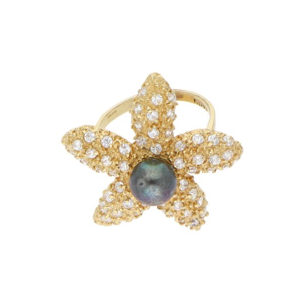 Anillo estilizado motivo estrella de mar con perla y circonias en oro amarillo 14 kilates. on Sale